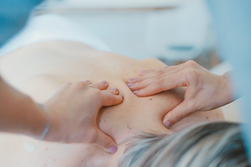 deep pressure massage technique on upper back for chronic tension relief